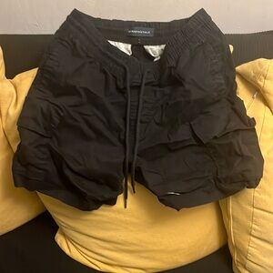 Black drawstring shorts that are too short for me.